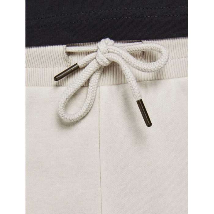 Pantalón de chándal con logo en el bolsillo en color moonbeam (beige) de la colección Jack & Jones Intelligence